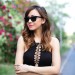 Famale model wearing sunglasses diagonal view