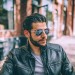 Man modeling aviator sunglasses angled view