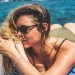 Female model with sunglasses diagonal view