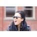 Female model wearing sunglasses diagonal view