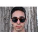 Male model wearing sunglasses with face closeup