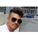 Male modeling sunglasses frontal view