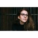 Woman wearing tortoise cateye eyeglasses